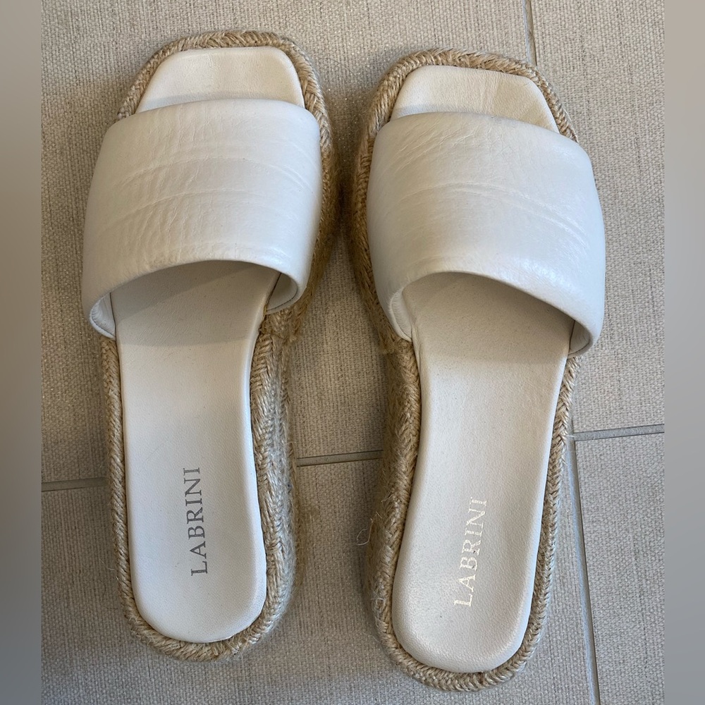 Cream Faux leather slide.